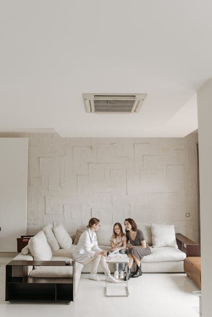 Mother and daughter consulting with a doctor in a modern home setting.
