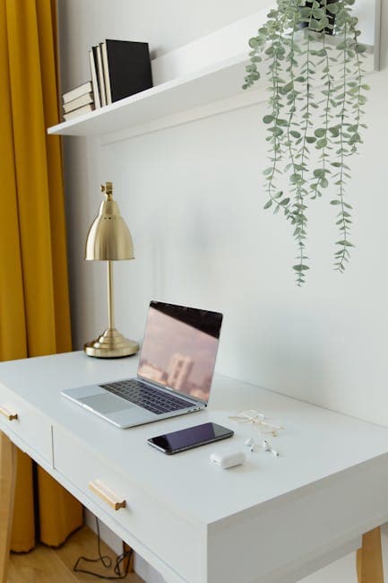 Stylish home office desk with modern technology ideal for productivity.